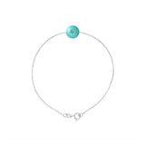 Le bracelet Perlinea Chaîne Forçat - Perle de Culture Bleu Turquoise se compose d'une chaîne en argent 925 avec une perle de culture ronde turquoise au centre, sur fond blanc.