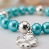 Bracciale portafortuna - Perla d'acqua dolce - Rotonda 5-6 mm Blu turchese