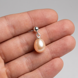 Orecchini con perle coltivate d'acqua dolce diametro 7-8 mm in oro bianco rosa
