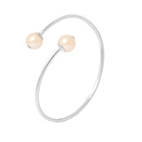 Bracelet jonc ouvert en argent 925 avec deux perles roses aux extrémités.